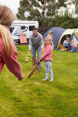 Family Playing Cricket Match On Camping Holiday © micromonkey