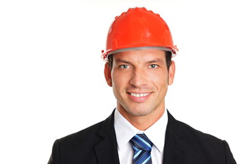 Smiling handsome businessman in a protective helmet