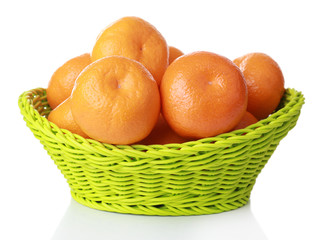 Tangerines in basket isolated on white