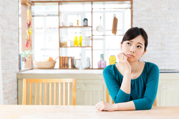 young asian woman in the kitchen