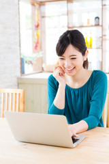 young asian woman in the kitchen