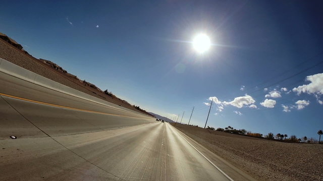 POV driving road trip American Freeway sun flare blue sky USA