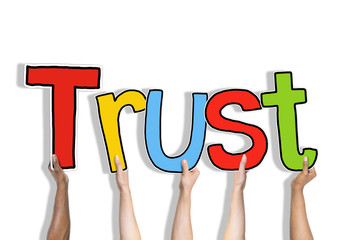 Diverse Hands Holding the Word Trust