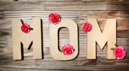 MOM text in big cardboard letters with flowers