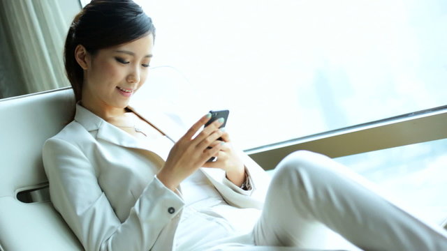 Asian Chinese Businesswoman Leisure Hotel Accommodation Smart Phone Text