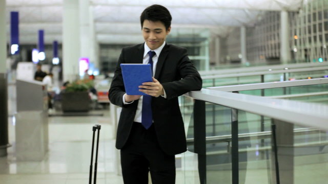 Young Asian Chinese Finance Travel Meeting Airport Tablet Technology