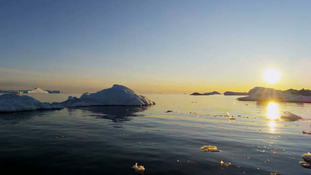 Disko Bay Greenland sunset floating glacial iceberg frozen 