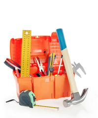 Plastic toolbox with various working tools isolated over white
