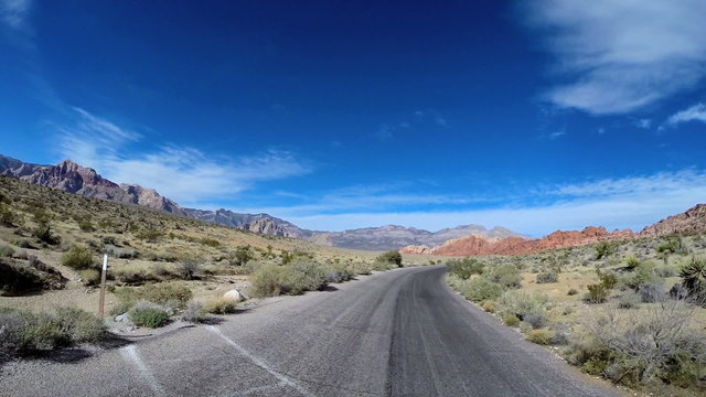 POV vehicle driving Red Rock Canyon State Route 159 Conservation area desert USA
