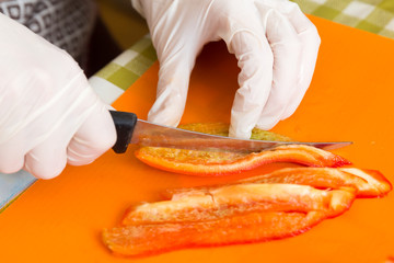 cut into disposable rubber gloves red sweet pepper