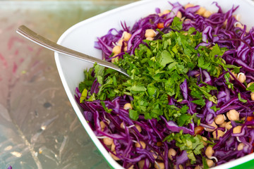 purple cabbage salad with pomegranate seeds and pepper