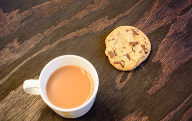 A cup of tea and a chocolate chip cookie