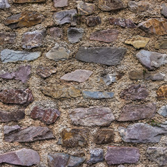 old stone wall. pattern of decorative slate stone wall surface.