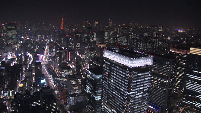 Aerial Metropolis illuminated skyscrapers Tokyo Tower Business District Japan