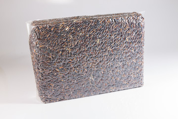 Brown rice in vacuum package  on white background