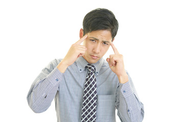 頭痛を訴えるビジネスマン