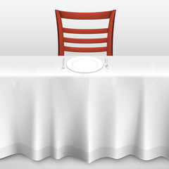 Table with a tablecloth and chair