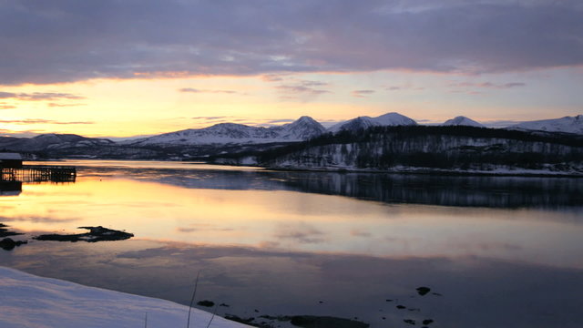 Fjord coastal resort nr Tromso sunset skyline Norway panning