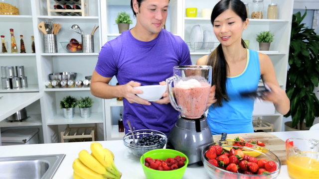 Healthy Ethnic Couple Homemade Smoothie Together 