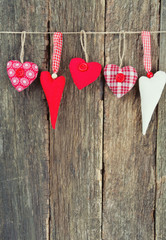 textile hearts on rustic wooden surface