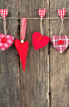 textile hearts on rustic wooden surface
