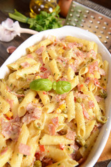 Penne pasta casserole with cheese, ham and corn