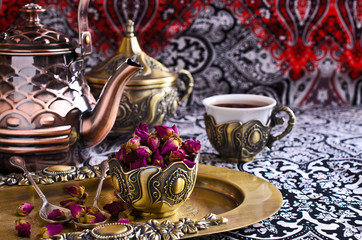 Dried rose buds in a metal Cup
