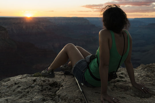 Girl watching sunset at Grand Canyon