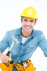 Confident carpenter using hammer