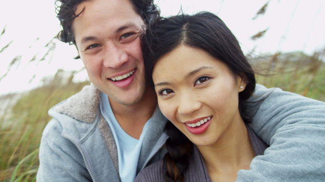 Portrait Smiling Young Asian Chinese Couple Fall Beach 