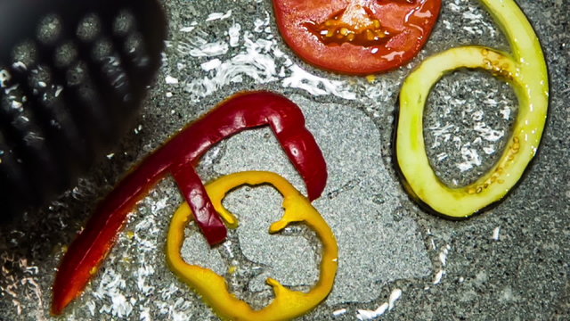 Letters of Vegetables Being Fried