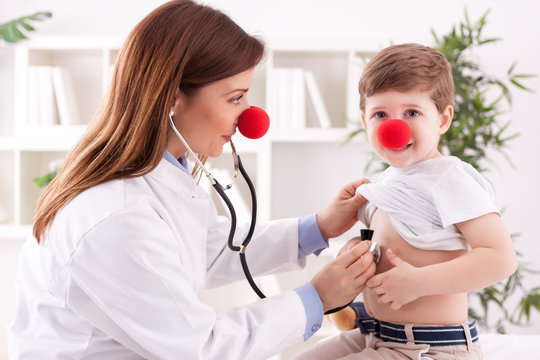 Doctor pediatrician and patient happy child