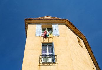 Fototapeta na wymiar House with open windows. Europe. France. Perpignan
