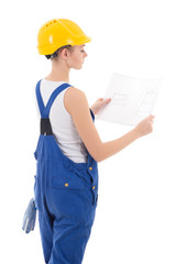 back view of woman builder in blue coveralls holding building sc