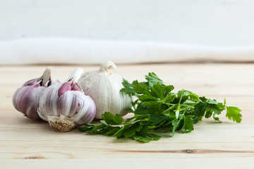 Composition of purple garlic with parsley