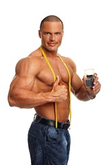 Handsome muscular man with meter and shows you calculator