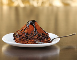 Yummy chocolate cupcake on table