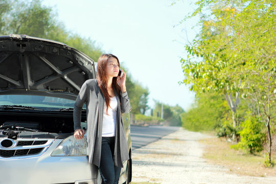 Woman Having Problem With Her Car