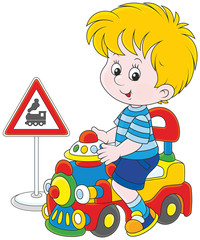 Naklejka premium Boy on a toy train