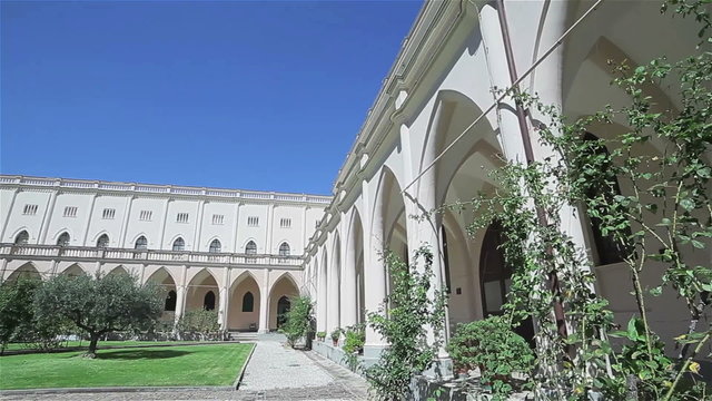 Italian monastery courtyard with columns. Flycam
