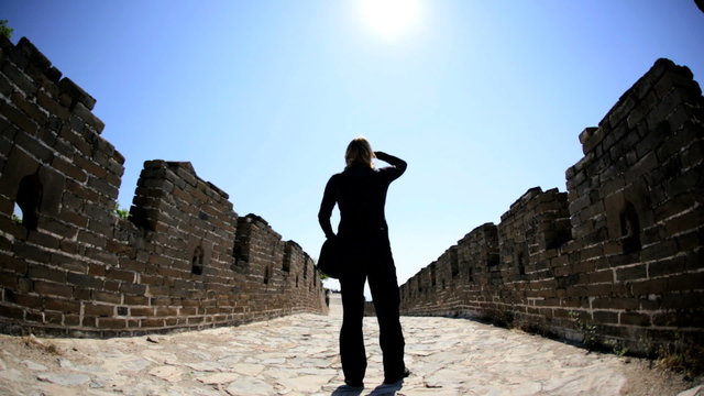 Tourist sun flare sightseeing Great Wall of China female Beijing