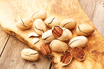 Pecan nuts on wooden table