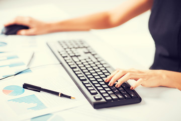 woman hands typing on keyboard
