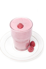 Cocktail of frozen  raspberry  with yogurt in a glass on a white