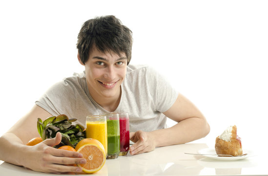Man choosing between fruits, smoothie,salad and a cake