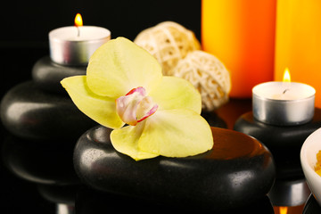 Beautiful spa composition with candles and orchid