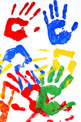 Hand prints of paint on white background