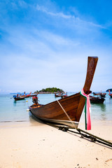 Traditional wooden thai boat on the beach, Thailand.