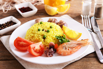 Seafood Paella on plate on table close-up