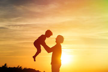 Fototapeta premium father and son play at sunset